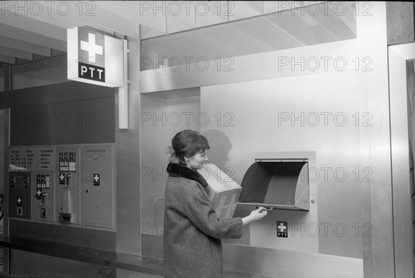 Customer at self service post office counter, Bern Gabelbach 1969