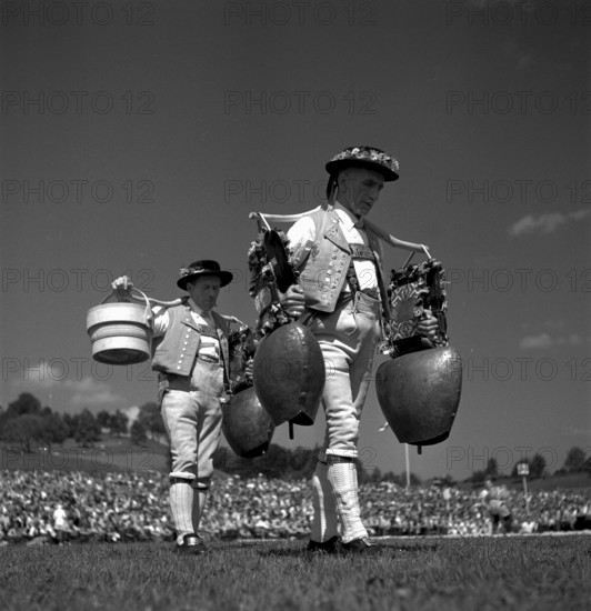 Swiss wrestling festival 1948 in Lucerne:men in traditional costume with bells