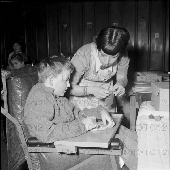 Student with handicapped children at school for social work, Zurich 1953