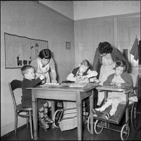 Student with handicapped children at school for social work, Zurich 1953