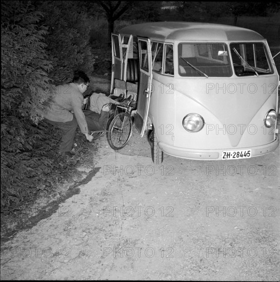 Loading wheelchair in a Volkswagen at school for social work, Zurich 1953