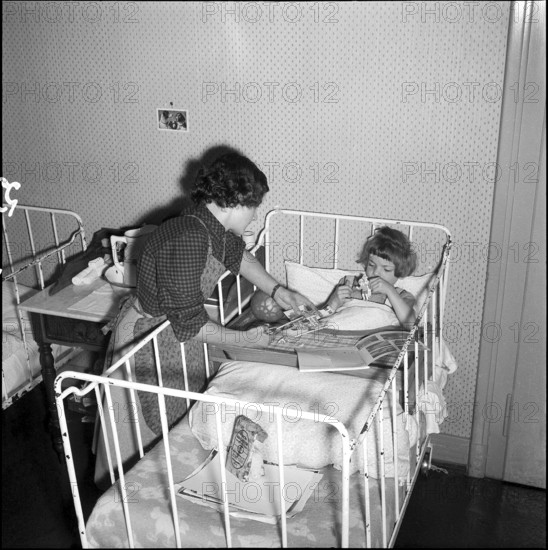 Sick girl in a crib at school for social work, Zurich 1953