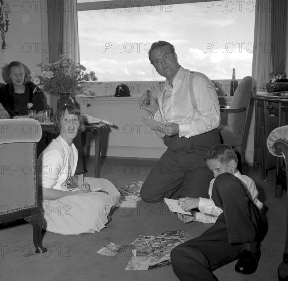 Red Skelton with his family in hotel room, Zurich 1957