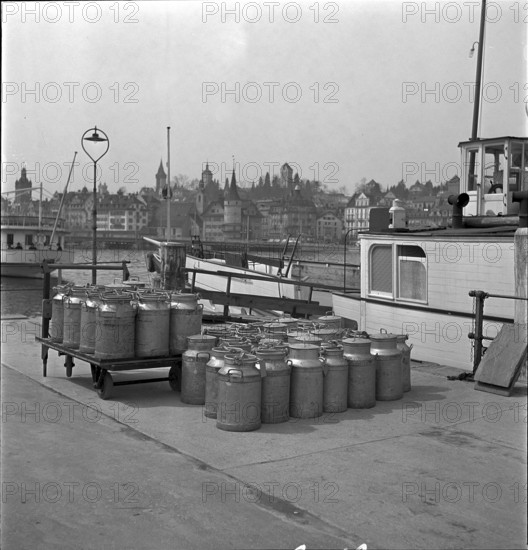 Lucerne, milk cans ready to transport by ship, Lake Lucerne 1940