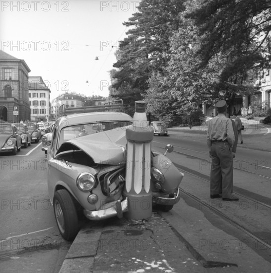 Car clash into road safety pile, traffic island on Universitatsstrasse Zurich 1959