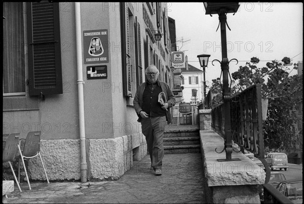 Swiss writer Friedrich Duerrenmatt leaving hotel restaurant ""Du Rocher"", Neuchatel 1977