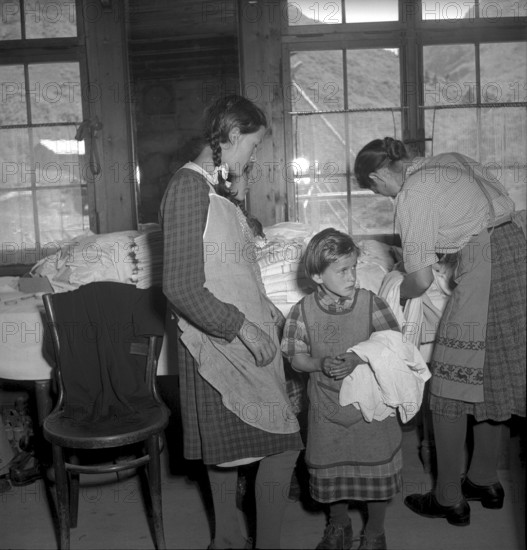 Relief supplies, clothes for the population of the completely burned down hamlet Selva 1949