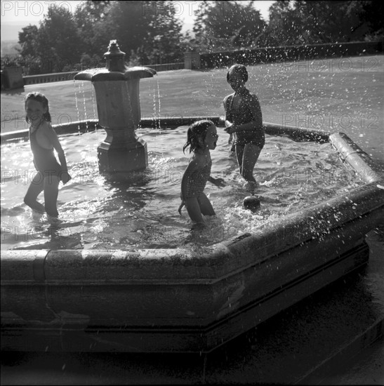 Children cooling in a fountain, Zurich 1952