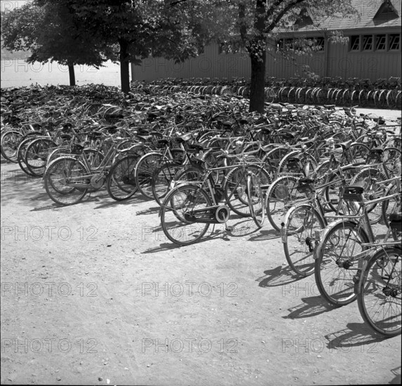 Bicycles parked at the entrance to a seaside swimming bath in Zurich 1952