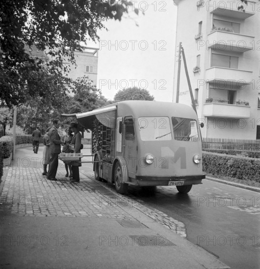 Zurich, Customer shopping in a Migros truck, mobile shop. Zurich 1947