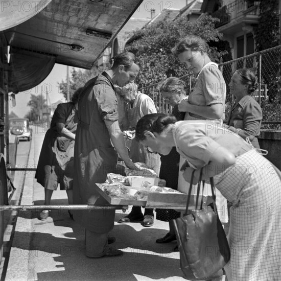 Zurich, Customers shopping in a Migros truck, mobile shop, 1947