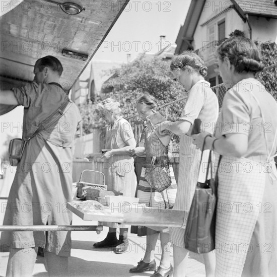 Zurich, Customers shopping in a Migros truck, mobile shop. Zurich 1947