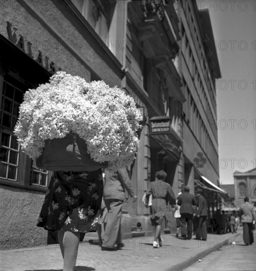 Woman from the country selling flowers in Zurich 1943
