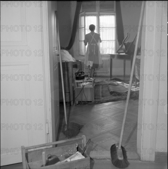 Basle, chambermaid cleaning a room, Hotel drei Konige 1954