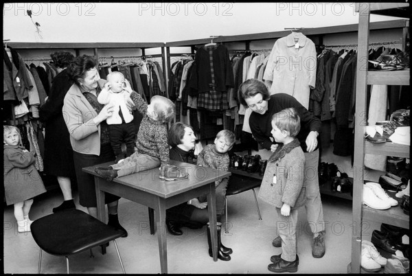 Shopping at a second hand clothes shop, 1968