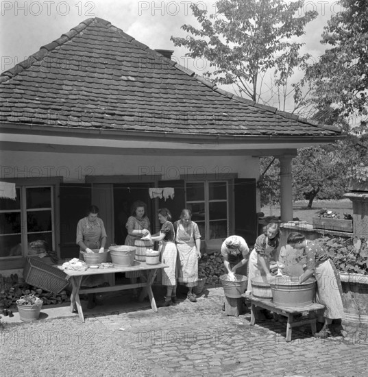 Washing clothes outdoor at women's school 'Heim' in Neukirch an der Thur, 1940