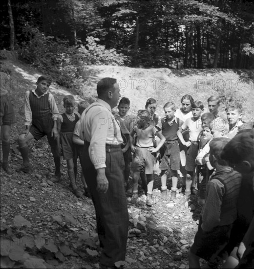 Teacher at outdoor cookery course for boys, 1940