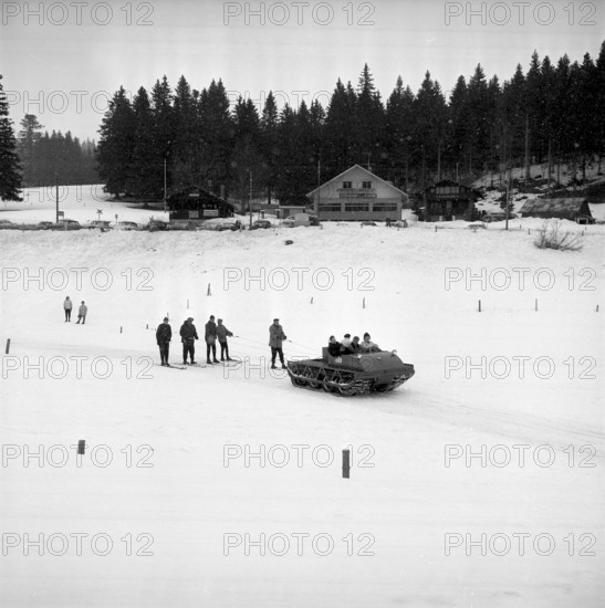 Skiers pulled by a snowmobile, St. Cergue 1961