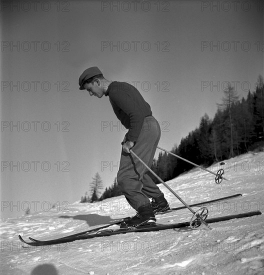 Ski instructor shows proper way to ski, stem turn, Davos 1940