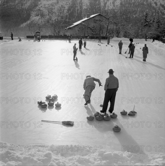 Men playing curling in St. Moritz 1947