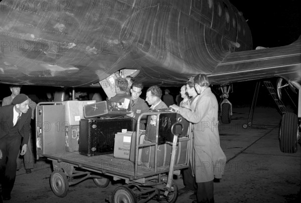 First Swissair flight from Switzerland to the USA, DC4 baggage loading, Geneva 1947