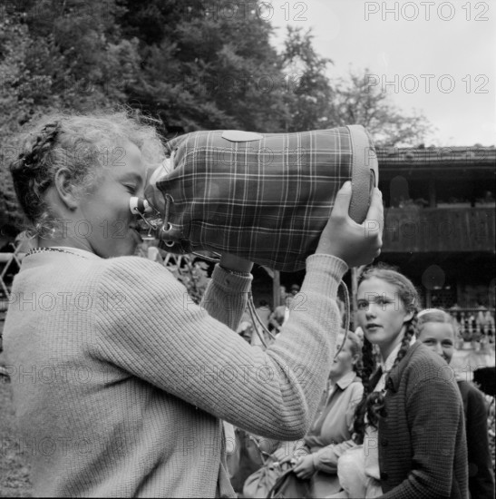 School outing to the Ruetli, girl drinking, 1958