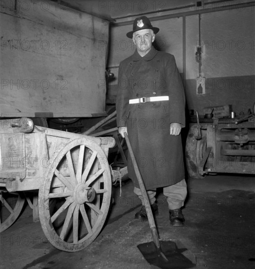Roadworker using fluorescent belt, Neuchatel 1950