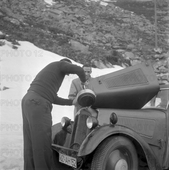 Automobilist pouring water into the cooler, Gotthard 1957