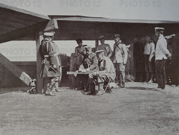 General Stessel and General Fock are sitting at the plan, General Kondratenko is standing at the column  Russo-Japanese War
