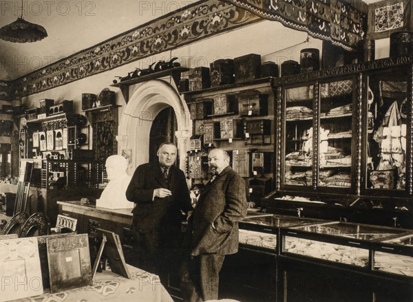 Sergei Timofeyevich Morozov (1863-1944, right) in the interior of the Handicrafts Shop 1925