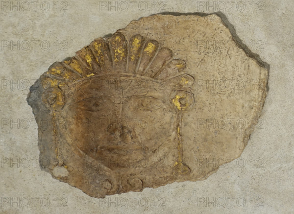 Gilded mask with crown