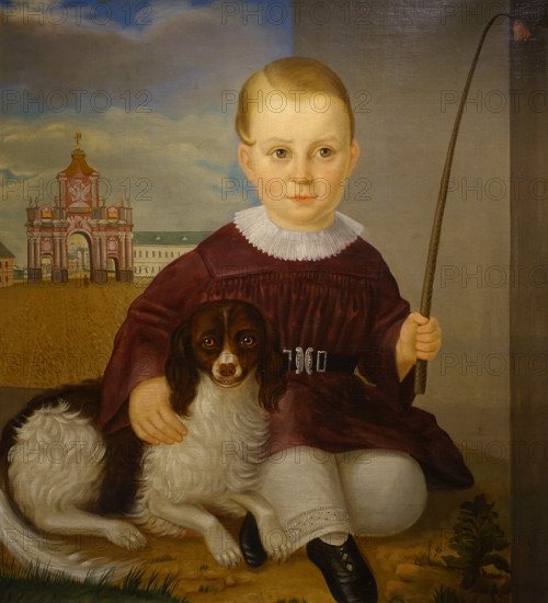 Portrait of a boy with a dog against the background of the Red Gate in Moscow