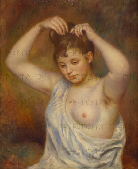 Woman arranging her hair