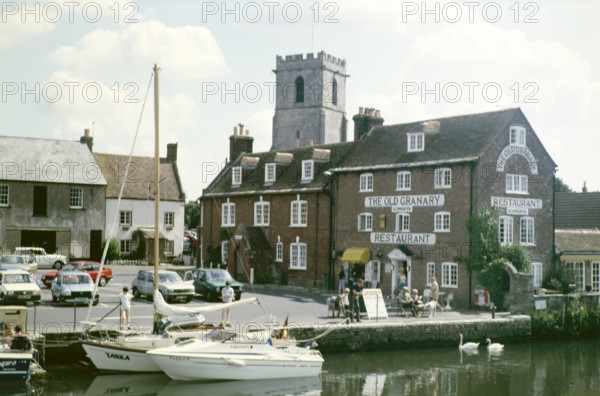 The Old Granary restaurant on the quayside and Priory Church of Lady St Mary.