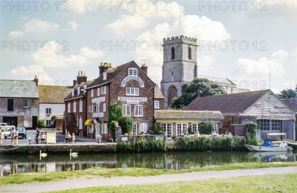 The Old Granary restaurant on the quayside and Priory Church of Lady St Mary.
