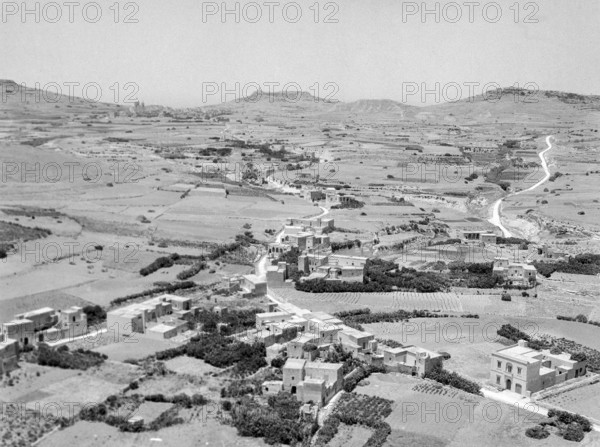 View from citadel in Victoria over countryside looking towards Ghasri and Giordan lighthouse in distance.