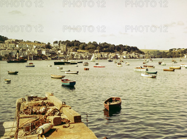 Boats at moorings in harbour of town Fowey.