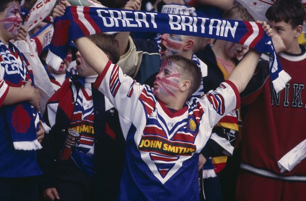 10000319 SPORT Supporters Rugby League Teenage fans holding Great Britain scarfs during the Great Britain v Australia game at Wembley Stadium.