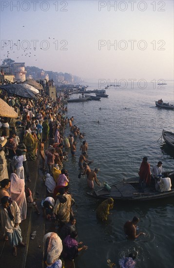 INDIA, Utter Pradesh, Varanasi, Crowds of people on the banks of the Ganges during Sivaratri festival.