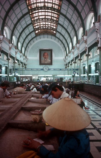 VIETNAM, Ho Chi Minh City, Post Office interior depicting glass canopy and iron framed roof.