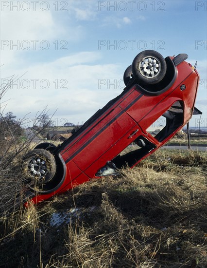TRANSPORT, Road, Car, Overturned car in ditch beside country road at crash scene.