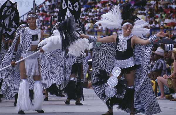 WEST INDIES, Barbados, Festivals, "Crop Over sugar cane harvest festival, Kadooment carnival parade dancers in black and white costumes,"