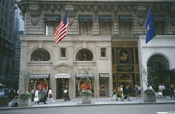 USA, New York , New York, Manhattan’s 5th Avenue Christian Dior shopfront with pedestrians walking past
