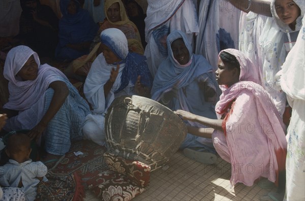 MAURITANIA, Atar, Women sitting around Womans Day drum