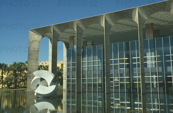 BRAZIL, Federal District, Brasilia, "Hamarati Palace, housing the Foreign Office, with modern sculpture on water outside"