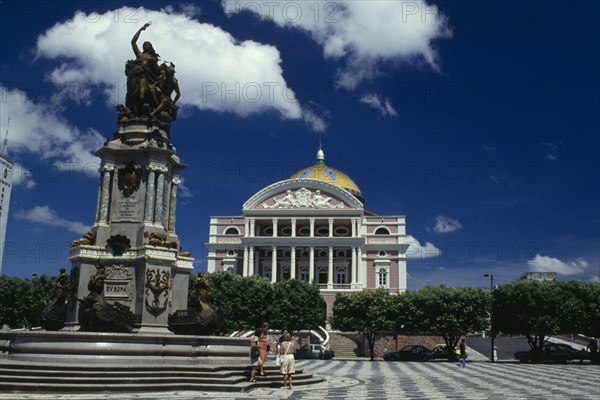 BRAZIL, Amazonas, Manaus, Opera House ornate exterior seen over square with central column and statue atop
