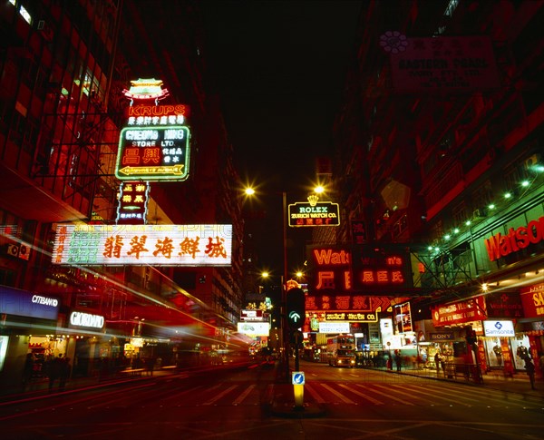 HONG KONG, Kowloon Peninsula, Kowloon, "Nathan Road at night with colourful neon lights, traffic and  pedestrian crossing. "