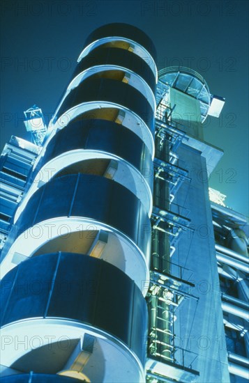 ENGLAND, London, Lloyds Building designed by Richard Rogers.  Exterior at night.