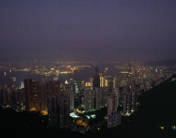HONG KONG, Victoria Peak   , Elevated view over the harbour illuminated at night with skyscrapers and the Bank of China
