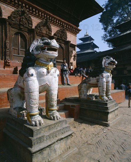 NEPAL, Kathmandu , Durbar Square. Two lion statues at entrance to temple.
